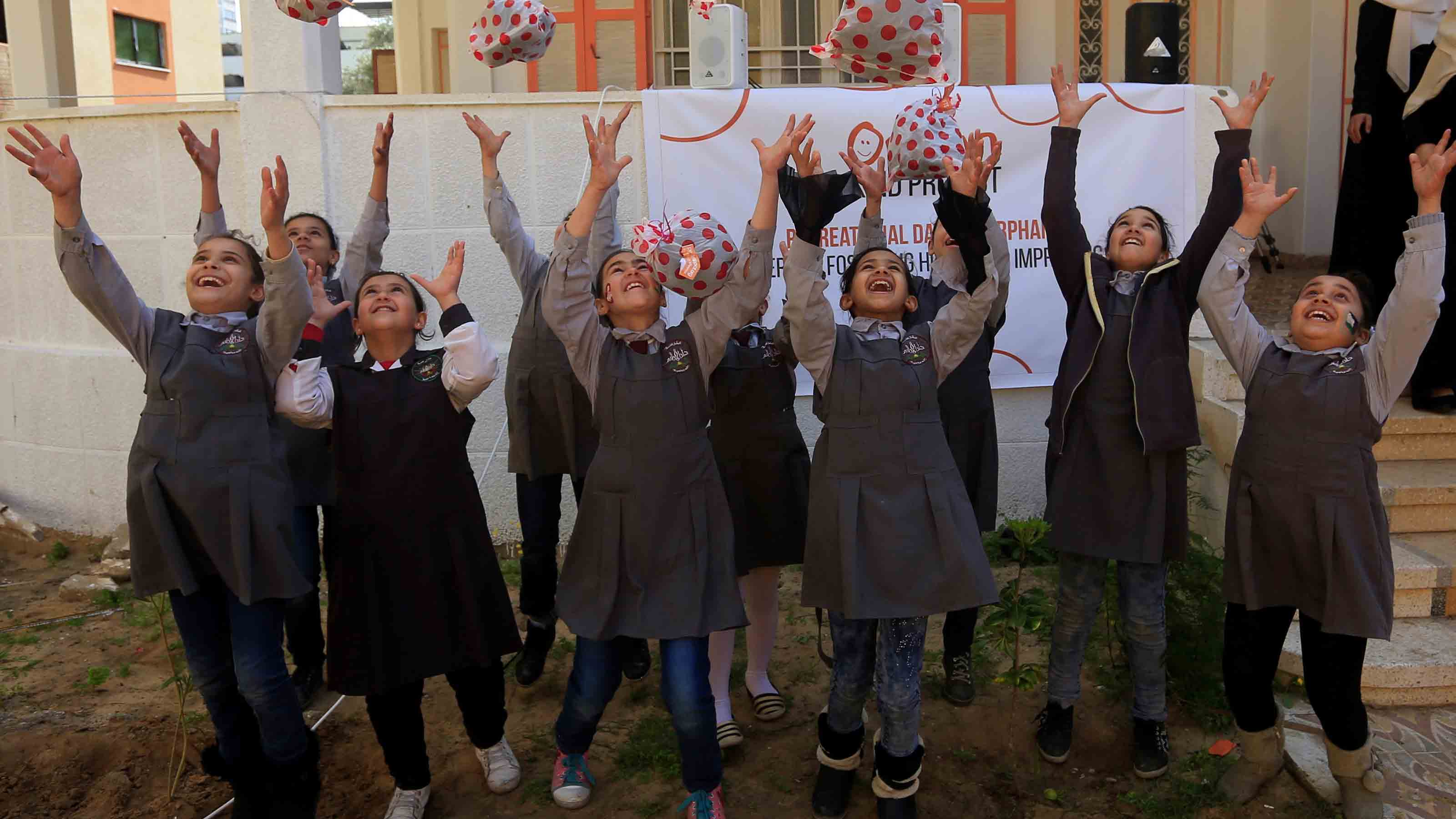 Group of children jumping for joy
